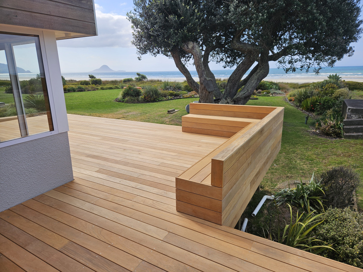 Finished coastal timber deck with a built-in bench seat